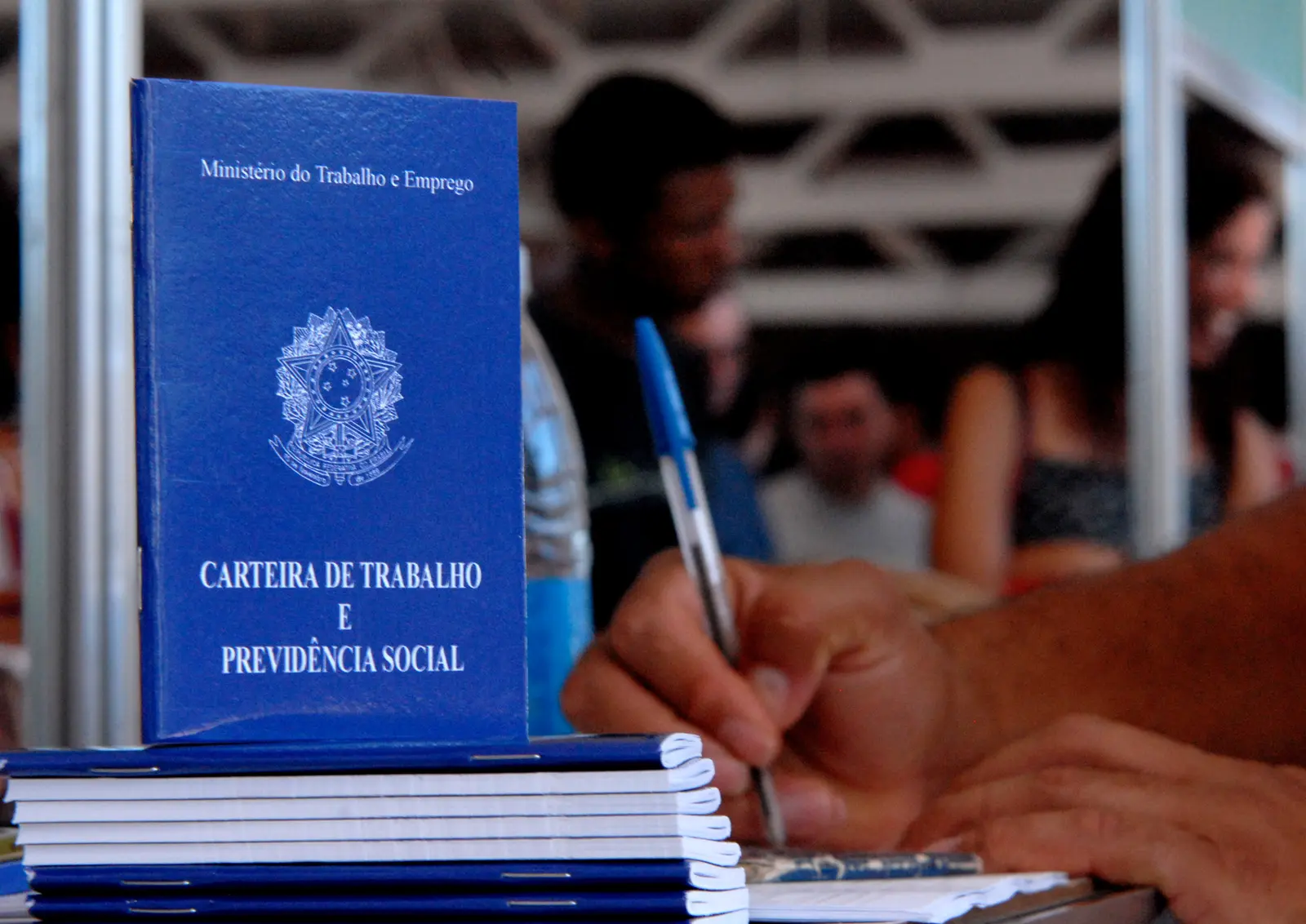Brazilian employment record booklets distributed at a public employment agency in Brasília.