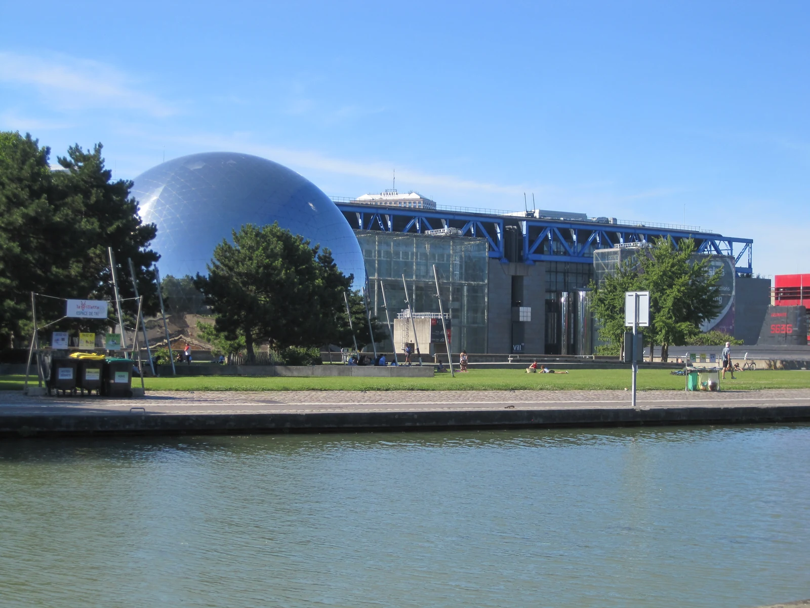 The Cité des sciences et de l’industrie and La Géode seen across the water in Paris.