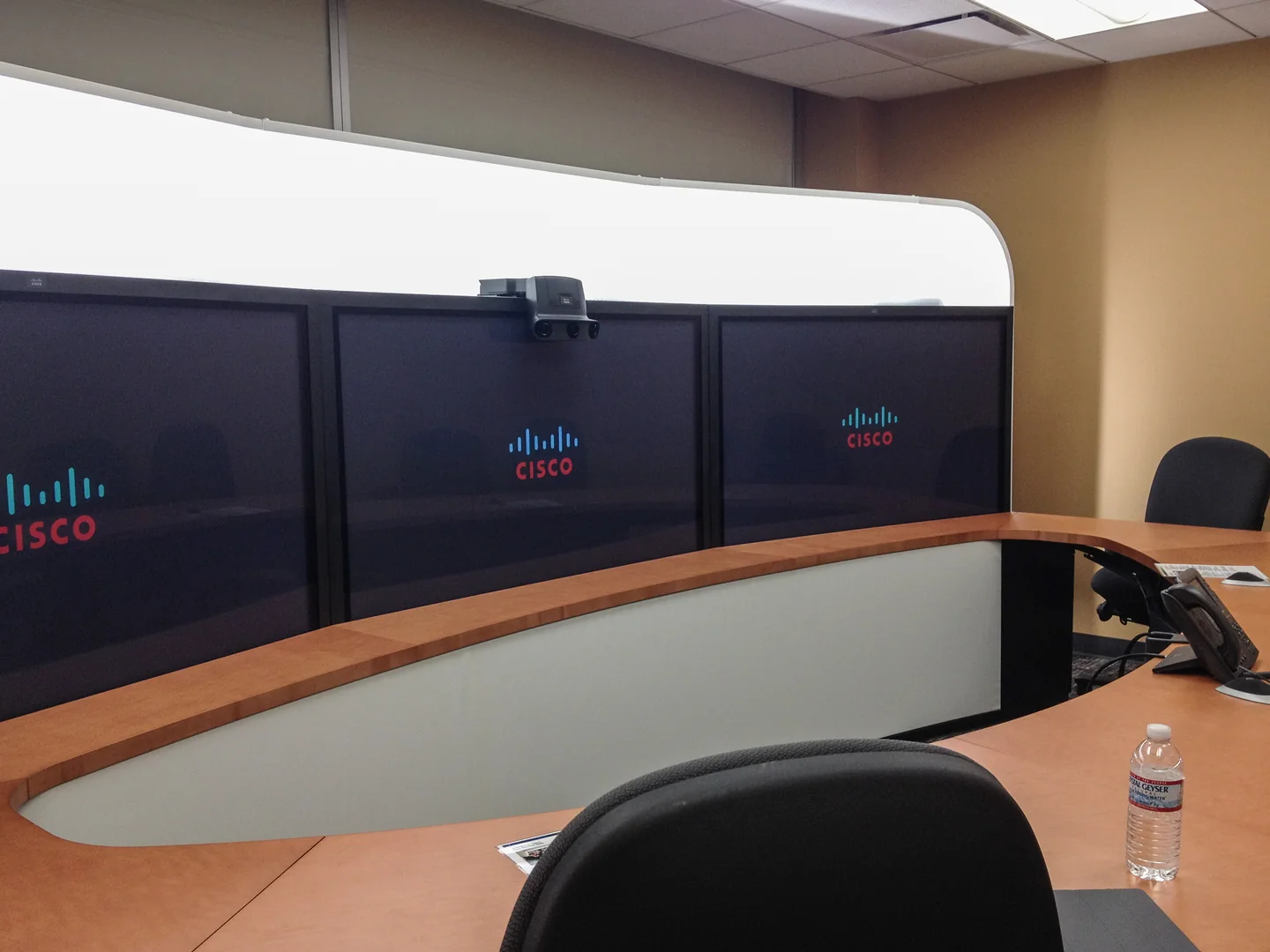 A conference room equipped with Cisco TelePresence videoconferencing screens