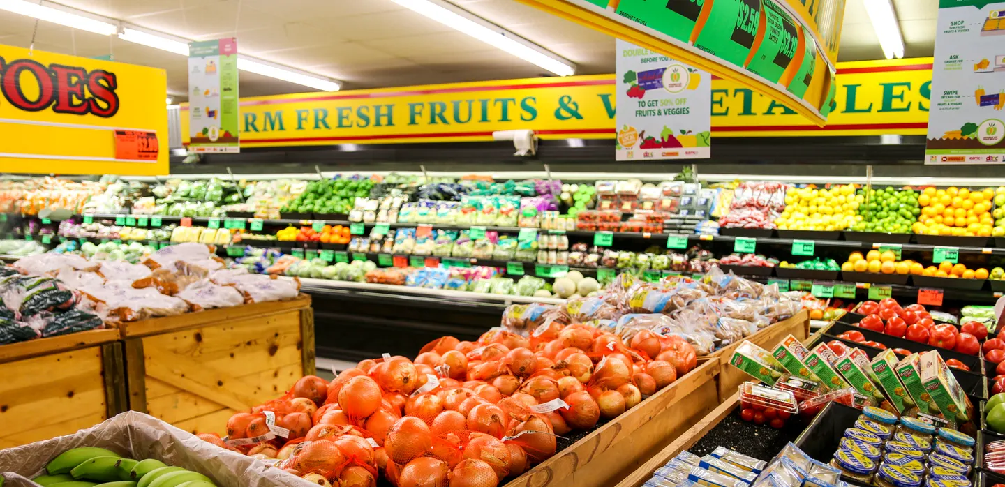Fresh fruit arranged across a grocery store produce display