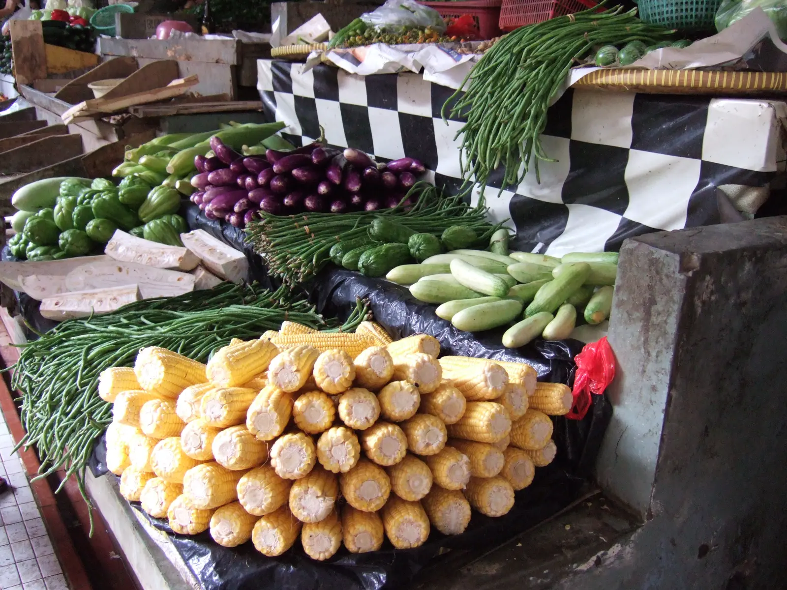 Corn, eggplants, cucumbers and other vegetables displayed at a shop in Jakarta.