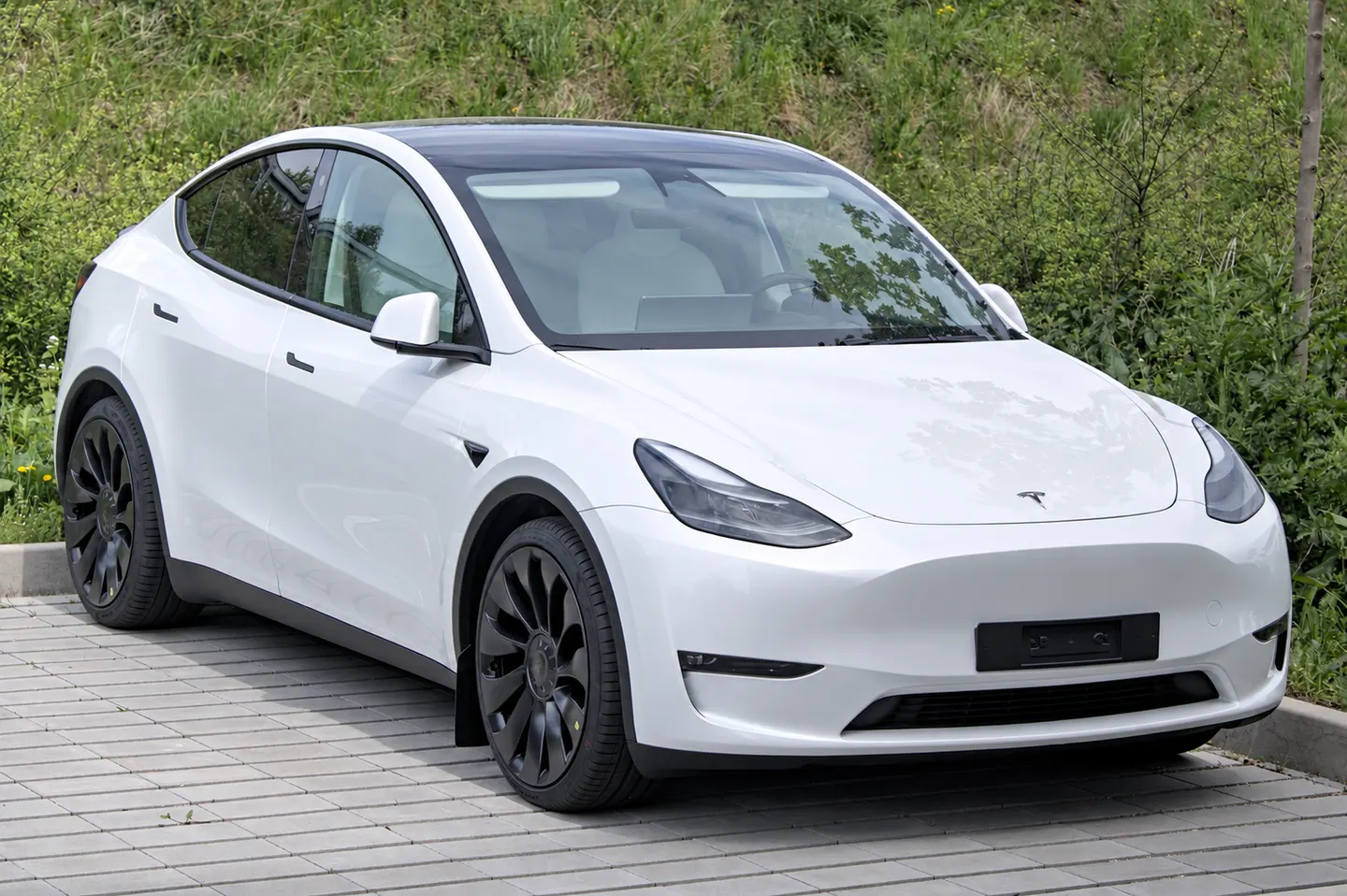 AI-adapted editorial illustration based on white tesla model y photographed in neu-ulm in 2024