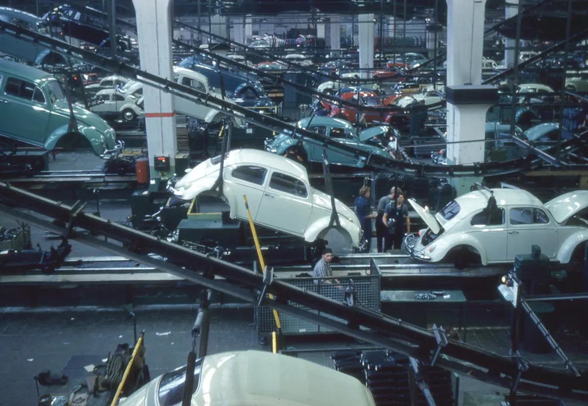 A historic Volkswagen Beetle assembly line in the Wolfsburg plant in 1960.